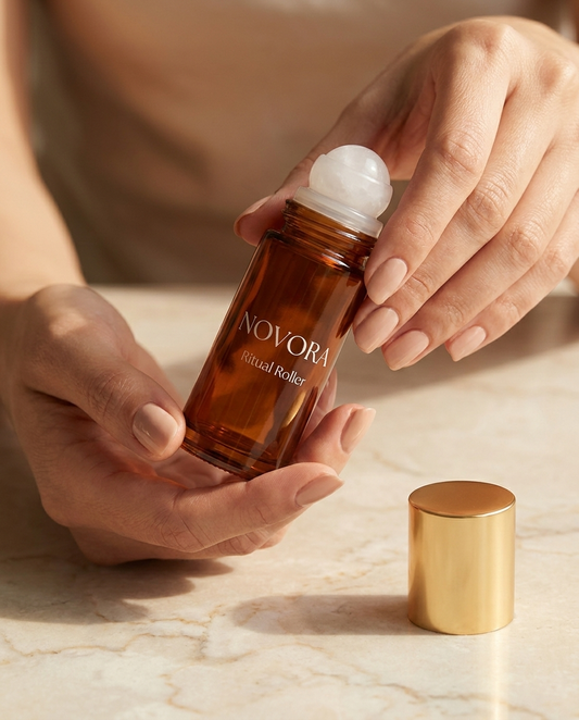NOVORA Ritual Roller — Hands holding bottle