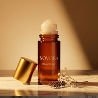 NOVORA Ritual Roller — Three-quarter angle with botanicals